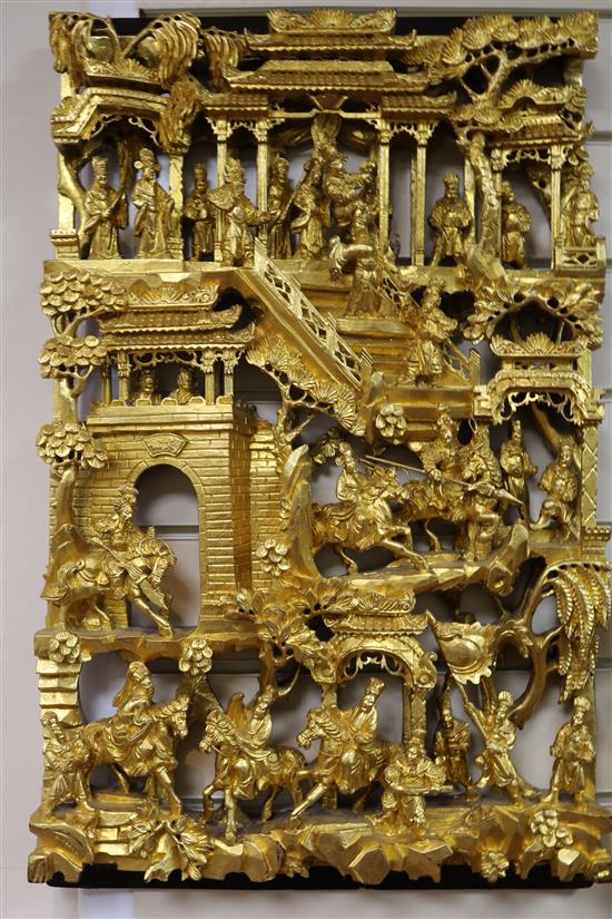 Six Chinese carved giltwood panels of soldiers amid pavilions